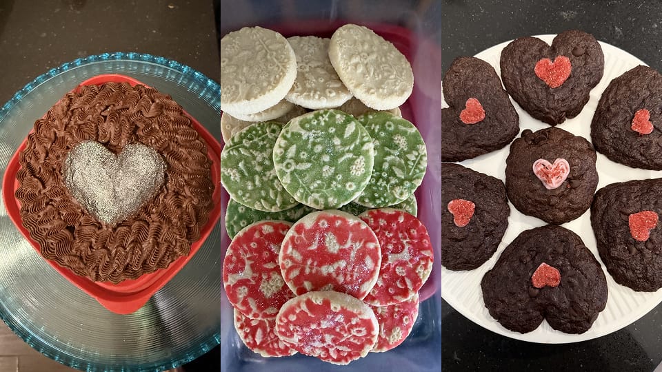The image shows three types of festive baked treats: a chocolate cake decorated with a glittery heart, colorful red, green, and white cookies with patterned tops, and dark chocolate heart-shaped cookies topped with red and pink sugar hearts. Each dessert has a playful, Valentine’s-inspired design,
